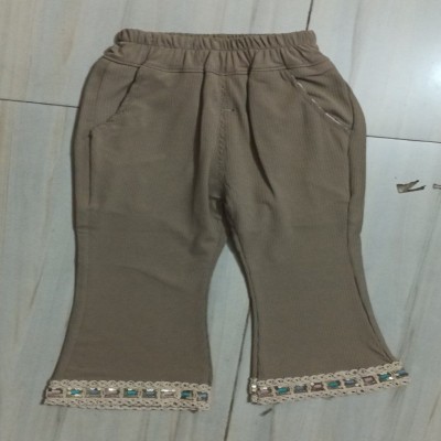 Beige Ribbed Bootcut Trousers with Embellished Lace Hem
