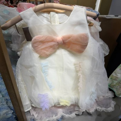 Elegant White Tulle Dress with Peach Bow & Pastel Ruffle Details