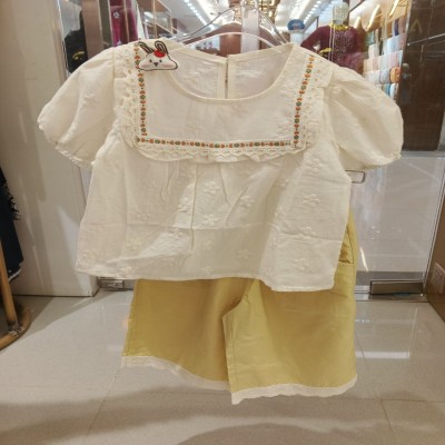 Embroidered White Blouse and Light Yellow Shorts